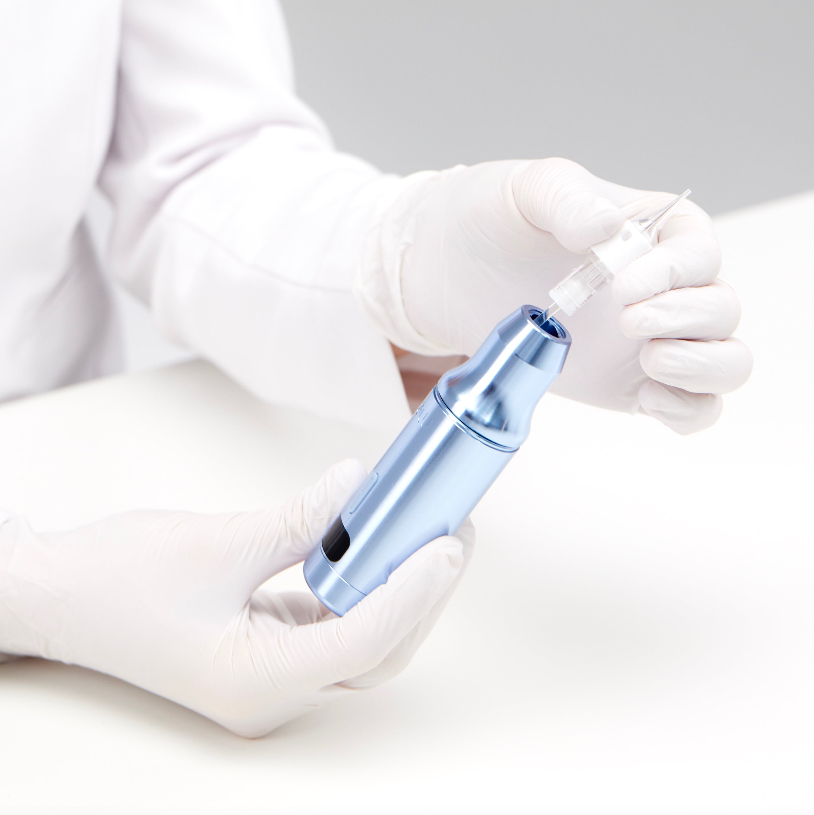 ME PMU machine for permanent makeup, high-precision device demonstrated by professional artist in gloves.